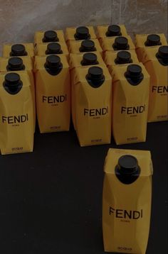 many yellow and black bottles are lined up