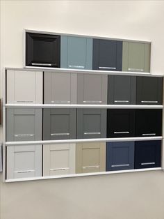 a wall with several different colors of cabinets on it