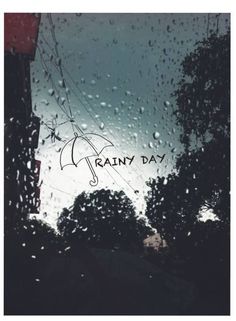 rain is falling down on the window and it says rainy day with an umbrella in the foreground