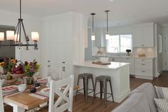 the kitchen and dining room are all white