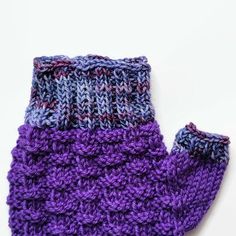 Basket weave design in purple mittens with contrasting cuffs and thumb in a variegated yarn. There are two brands of yarn: 75 percent superwash merino wool and 25 percent nylon yarn in the body, and 100 percent merino wool yarn in the contrasting cuffs and thumb. Length: 7 inches. Width, below thumb:  3 1/2 inches. Hand wash in cool water and dry flat. Or machine wash, gentle cycle, in cool water and dry flat. Purple Yarn, Variegated Yarn, Merino Wool Yarn, Driving Gloves, Fingerless Mittens, Jan 20, Wool Knit, Basket Weave, Wool Yarn