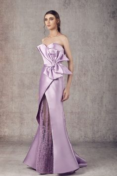 Looking for a unique and eye-catching dress? Check out the Ziad Germanos WA0136 Mikado purple and tule purple dress! This beautiful dress is perfect for making a statement at any formal event. With its Mikado purple and tule purple colors, you're sure to turn heads when you walk into the room. The Ziad Germanos WA0136 dress is also extremely comfortable, so you'll be able to dance the night away without any issues. Order yours today and be the talk of the party! Purple Dress Elegant, Designer Dress Patterns, Wedding Dress Purple, Mnm Couture, Couture Evening Dress, Plastic Dress, Red Evening Dress, Evening Dress Fashion, Column Dress