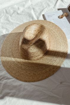 Lack of color Palma Wide Fedora is handmade by artisans in Mexico, our new 100% baked palm leaf hats are perfect for the Summer soiree of your choice. Featuring a cowboy crown and tightly woven pressed palm, this hat is made for Summer. Natural Palm Leaf wide-brimmed western hat 100% Palm Leaf in Natural Inner elastic sweatband to help with fitBrim measures approx. 12 cm / 4.7” Sits higher on head Spot / specialist clean This hat is accredited with a UPF Rating 50+ (Australian Tested) Please note, hat features including straw color and brim width may vary slightly from piece to piece. These hats are individually handcrafted by artisans, each with its own unique character. We want your new hat to be as unique as the person wearing it and consider this a contribution to the unique character Western Style Palm Leaf Straw Hat With Flat Brim, Artisan Fedora For Beach In Spring, Western Palm Leaf Hat With Curved Brim, Artisan Straw Hat With Curved Brim For Spring, Artisan Panama Hat For Spring Beach, Artisan Panama Hat For Beach In Spring, Artisan Handwoven Summer Straw Hat, Western Style Wide Brim Panama Hat In Palm Leaf, Western Wide Brim Panama Hat In Palm Leaf