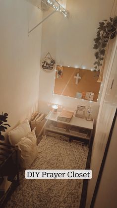 a living room with a couch, table and mirror on the wall next to it that says diy prayer closet