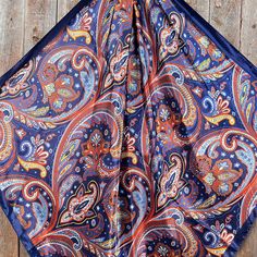 Our classic wild rag/scarf in blue with a hippie paisley pattern. A perfect square - measuring 35"x35". Adding that extra touch of a western style to your outfit. 100% soft silk feeling polyester is durable to keep you warm in the cold and fashionable for any occasion. Plus it's machine washable ! Additional accessories are available- (Please see our slide options on our site) Leather slides Western concho slides Crystal concho slide Buckle slides Blue Bohemian Scarf With Paisley Print, Blue Bohemian Paisley Print Scarves, Blue Paisley Print Bohemian Scarf, Bohemian Blue Bandana Scarf, Bohemian Blue Scarf Bandana, Outfit Western, Wither Strap, Beaded Dog Collar, Bridle Bag