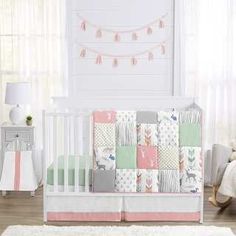 a baby crib bedding set in a nursery