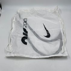 Brand New Nike Air Zoom White Black Nylon Track & Field Drawstring Shoe Bag! All Photos In This Listing Were Taken By Beskicks And The Item In The Photos Are Exactly What You Will Receive! - We Ship Out Same Day, Next Day At Most. White Nylon Bag, Functional White Nylon Gym Bag, White Nylon Gym Bag, Casual White Nike Bag, White Casual Drawstring Bag For School, Casual White Drawstring Bag For School, Nike White Everyday Bags, Nike White Sporty Bag, Nike Nylon Gym Bag