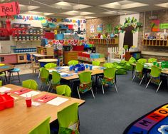 an empty classroom with desks and chairs