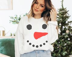 Your winter wonderland dreams will come true with our large playful snowman Sweatshirt. Our frosty face snowman will keep you warm and cozy throughout the holiday season. Grab your cocoa and build a snowman in this adorable classic Christmas sweatshirt. Snowman Christmas Sweatshirt | Couples Christmas Sweatshirt | Snowman Sweater | Christmas Snowman Sweater | Winter Sweatshirt| Snowman Sweat A sturdy and warm sweatshirt bound to keep you warm in the colder months. A pre-shrunk, classic fit sweat Fun White Sweatshirt For Winter, Fun White Winter Tops, Fun White Tops For Winter, Rudolph Outfit, Snowman Sweatshirt, Dreams Will Come True, Snowman Sweater, Couples Christmas, Make A Snowman