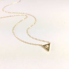 Triangle Necklace, Tiny Floating Cubic Triangle Necklace, Triangle Pendant, Charm Necklace, Delicate Gold or Silver Cubic Necklace, Cubic Triangle Pendant Necklace, Cubic Pendant, CZ Triangle Necklace, Gold or Silver Layering Necklace, Delicate Necklace, 14k Gold Filled or Sterling Silver, Gift Floating Cubic Triangle Necklace Composed of at 12x10.4mm gold or silver plated triangle pendant with 5 tiny cubic zirconia's stacked within and hung from delicate 14k gold filled or sterling silver chain Minimalist Triangle Jewelry For Anniversary, Gold Cubic Zirconia Jewelry With Trillion Cut, Gold Triangle Jewelry For Anniversary, Gold Trillion Cut Cubic Zirconia Jewelry, Dainty Triangle Jewelry For Gifts, Dainty Triangle Jewelry Gift, Elegant Gold Trillion Cut Necklace, Dainty Gold Triangle Jewelry, Minimalist Gold Triangle Jewelry