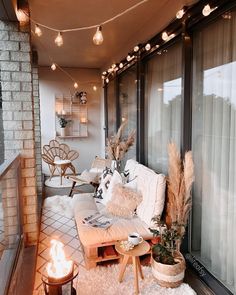 an instagram photo of someone's living room with lights strung from the ceiling