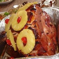 the meat has pineapple slices on it and is ready to be cooked in the oven