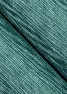 a close up shot of the fabric in teal green