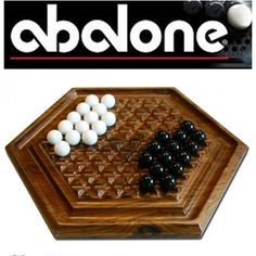 a wooden board game set with black and white marbles on it, in front of the abaone logo