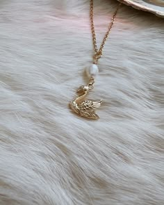 🦢  Please be aware that the pearl connector can range in sizes due to its natural nature. Some of the pearl connectors may be like the one you see in the photo and some may be a little bit bigger. This gorgeous swan necklace piece is truly one of a kind. Created with loving intentions as well. This piece makes for a wonderful gift for yourself or a loved one. 🌹 The swan charm is 18k gold stainless steel and the chain is 18k gold stainless steel.  The pearl hanging on the necklace is a real freshwater pearl 🐚 Swans symbolize so many beautiful things on its own. Swans symbolize purity, healing, elegance, soulmates, love and truth. Swans also connect to Venusian energy and the Greek goddess Aphrodite 🌹 Freshwater pearls symbolize purity, harmony, humility and femininity. Pearls connect to Swan Gifts, Aphrodite Jewelry, Aphrodite Necklace, Venus Jewelry, Swan Jewelry, Jewelry Pearl Necklace, Swan Pendant, Swan Necklace, Dainty Gold Jewelry