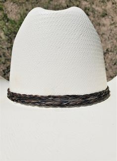 "Double braided equine/horse hair Hatband.  Handmade horse hair hatband can be made with your horse's hair or we can make it with our stock horse hair (please let me know which one your prefer).  The ends of the hatband are Stainless Steel and includes a deerskin buckskin tie in back to make the hat band somewhat adjustable.  Tie can be black, rusty brown, brown, natural, turquoise, or blue.  Shown on a size 7 hat.  Hats are not included. Hat Band can be made with horse hair tassels that hang fr Adjustable Brown Mini Hats Country Style, Adjustable Country Hat Bands For Riding, Handmade Adjustable Hat With Round Crown, Handmade Adjustable Mini Hats For Country Events, Adjustable Brown Hat Bands For Riding, Handmade Adjustable Round Crown Hat, Bohemian Braided Brown Hat Band, Handmade Adjustable Mini Hat Headband, Adjustable Brown Country Mini Hat