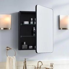 a bathroom sink with a medicine cabinet above it