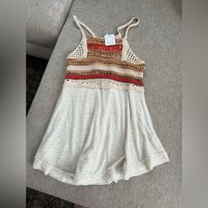 Brand New Flowy Tank Top. The Top Half Looks Like It’s Crocheted. Size X-Small From Free People Beige Crochet Top For Fall Vacation, Casual Sleeveless Crochet Trim Knit Top, Casual Fitted Top With Crochet Trim, Spring Bohemian Knit Top For Vacation, Bohemian Knit Top For Spring Vacation, Bohemian Spring Vacation Knit Top, Sleeveless Knit Top For Beach In Fall, Summer Cotton Crochet Top For Day Out, Beige Bohemian Tank Top For Day Out