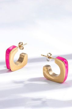 Add something fun to your jewelry collection with the Geometric Hot Pink Hoop Earrings, a stunning blend of enamel and 18K Gold Plated Stainless Steel. Perfect for any occasion, these earrings are designed to add a touch of sophistication to your everyday look. - .8" Long and .7" Wide - Gold Plated Stainless Steel - It comes with a cleaning cloth and storage bag - Care instructions: To preserve its shine and quality, keep your jewelry dry. Trendy Nickel-free Enamel Earrings, Trendy Enamel Nickel-free Earrings, Small Hoop Enamel Earrings For Gift, Enamel Small Hoop Earrings For Gift, Small Hoop Enamel Earrings Gift, Gold Enamel Hoop Jewelry, Trendy Gold Enamel Earrings, Pink Small Hoop Metal Earrings, Pink Small Hoop Earrings In Metal