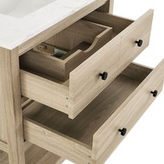 a bathroom vanity with two drawers and a sink in the middle, on a white background