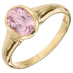 Pastel pink tourmaline bezel set Bvlgari ring. 1.68ct pink oval bezel set Tourmaline, 18k yellow gold setting. 1 oval pink tourmaline, approx. 1.68cts Size 8.25 and sizable 18k yellow gold Stamped: 750 Hallmark: Bvlgari 4.8 grams Pink Oval Sapphire Ring With Bezel Setting, Formal Pink Sapphire Ring With Bezel Setting, Pink Oval Ring With Bezel Setting, Oval Pink Ring With Bezel Setting, Classic Pink Bezel Set Ring, Classic Pink Rings With Bezel Setting, Classic Pink Oval Cabochon Ring, Bvlgari Ring, Rose Pastel