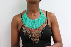 African beaded fringe necklace, Beaded Multi-strand necklace, Beaded Women necklace, Statement Necklace, Christmas gift for her, Moms gift An elegant necklace that can match any outfit. Handmade by the Maasai women in Kenya using fine beads. Color: Turquoise and multicolor Dimensions:  Necklace length: 18 inches/ 46 cm Neck size: 15 inches / 38 cm 3-5 days delivery via DHL Express.  Pay shipping fee for the first item only and additional items ship for free. To view more items in our shop, kindly click here:  nkoroicrafts.etsy.com Beaded Fringe Necklaces With Round Beads As Gifts, Beaded Fringe Necklace With Round Beads As Gift, Gift Necklace With Beaded Fringe And Round Beads, African Inspired Jewelry, Fringe Necklace, Women Necklace, Christmas Gift For Her, African Beads, Necklace Beaded