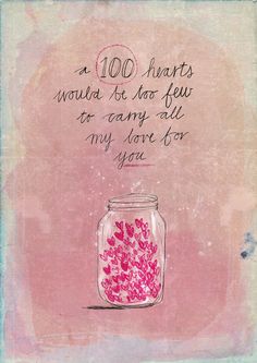 a jar filled with pink hearts sitting on top of a table