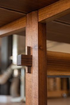 a close up view of a wooden table with an iron cross on the top and bottom