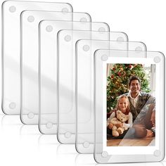 a set of five clear photo frames with a christmas tree in the background and a man holding a teddy bear