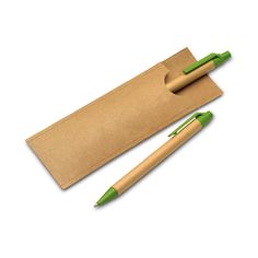 two green pens sitting on top of a brown envelope