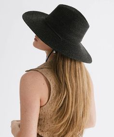 Keep the sun rays at bay with our raffia straw Ozzy Lifeguard Hat. Indulge in versatility with our relaxed a-line wide brim hat, where style seamlessly meets functionality. The intricately woven straw boasts a tight weave, providing optimal sun protection for all your outdoor escapades. Size: 57 (S/M) Black Summer Sun Hat For Warm Weather, Chic Braided Sun Hat With Curved Brim, Chic Braided Brimmed Sun Hat, Chic Brimmed Braided Sun Hat, Black Bohemian Straw Hat For Summer, Adjustable Black Straw Hat Made Of Paper Straw, Black Wide Brim Straw Hat With Upf 50+, Black Straw Hat Upf 50+ For Beach Season, Black Wide Brim Straw Hat Upf 50+