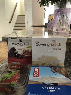 boxes of chocolate chip, power crunch and truffle are sitting on the counter