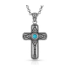 Montana Silversmiths� Faith on Point Turquoise Cross Necklace enhances the classic cross necklace. The silver-tone cross necklace features a center turquoise stone adding beauty and color. Covering the background of the cross is a detailed etched design and displayed at the bottom is an etched arrow. On the outside edge of the cross, a twisted rope completes the design. The pendant hangs on a silver-tone 19" chain. This necklace from Montana Silversmiths features a silver over brass base pendant Southwestern Style Silver Cross Pendant Necklace, Southwestern Silver Cross Jewelry, Southwestern Silver Cross Pendant Necklace, Southwestern Style Silver Cross Necklace, Southwestern Style Silver Cross Necklaces, Southwestern Silver Cross Necklace, Turquoise Cross Necklace, Turquoise Cross, Southwest Jewelry