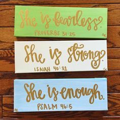 three wooden signs that say she is fearless, she is strong and she is enough