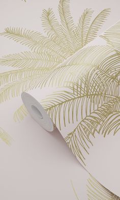 a white and gold palm tree wallpaper with metallic foiling on it's edges