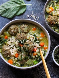 two bowls of soup with meatballs and vegetables