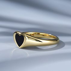 Our stunning 'Black Heart' ring serves as a perfect bold ring for those into something a little different. It is perfect for stacking with any other rings, and is the perfect addition to your collection.Weight: 2.6 gWidth: 2.1 mmHeight: 3 mmThickness: 1.2 mmMaterial: 925 SilverPlating Color: Yellow Gold Stackable Heart Open Ring For Valentine's Day, Modern Heart Cut Rings For Gifts, Modern Heart Ring For Valentine's Day Gift, Modern Promise Ring For Valentine's Day, Modern Heart Shaped Promise Ring, Modern Valentine's Day Promise Ring, Modern Heart-shaped Promise Ring, Elegant Stackable Midi Rings For Valentine's Day, Elegant Black Rings For Valentine's Day