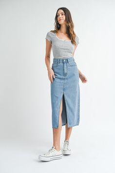 This solid denim midi skirt features a front slit and back shadow pocket detail, making it a stylish and versatile addition to your wardrobe. The slit adds a touch of flair while the pocket detail offers functional convenience. A must-have for any fashion-forward individual. Denim Midi Skirt, New Tops, Pocket Detail, Denim Dress, Denim Skirt, Must Haves, Fashion Forward, Midi Skirt, Active Wear