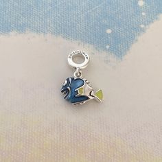 💖This sterling silver dangle charm features the much-loved forgetful fish brought to life with hand-applied enamel in transparent blue,yellow and black,with raised detailing on her fins and a characteristic sunny smile.Add this charm to your line-up as a reminder to stay focused on your goals - and never forget to look on the bright side! 💖Packaging:All the items are brand new,and will be sent in a clear plastic bag,put it into the box. 💖All the items are made from genuine 925 sterling silver,we highly appreciate a positive review if you are satisfied with our service. 💖Payment Option:You can pay with PayPal,but you don't have to have a PayPal account to make an order,you can simply pay with your credit card via PayPal checkout. 💖If your package doesn't arrive within the estimated del Look On The Bright Side, Clear Plastic Bags, On The Bright Side, Silver Charm Bracelet, Bright Side, Dangle Charms, Stay Focused, Bracelet Necklace, Sterling Silver Charm