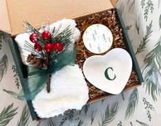 an open box filled with christmas items on top of a table