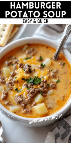 hamburger potato soup in a white bowl with a spoon