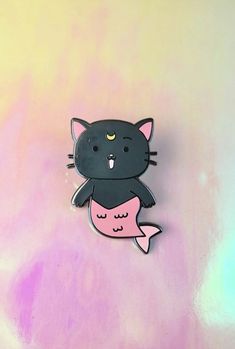 a black cat with a pink fish on it's back