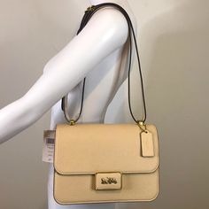 Featured Authentic Coach Alie Leather Shoulder Crossbody Handbag In Excellent Condition Nwt $595 Ivory Cream Colored Genuine Leather Purse With Adjustable Straps. Approximately 9”L X 6 ½”H X 3 ¼”W Measurements. Dust Bag Included In New Condition....Never Used Or Worn.....Smoke Free Environment Still Available Coach Alie Cream Leather Authentic Shoulder Handbag Beige Textured Leather Shoulder Bag For Formal Occasions, Coach Beige Rectangular Bag, Classic Beige Flap Bag With Detachable Strap, Classic Cream Flap Bag With Gold-tone Hardware, Classic Beige Satchel With Gold-tone Hardware, Classic Beige Flap Bag With Gold-tone Hardware, Beige Flap Bag With Gold-tone Hardware For Office, Classic Coach Bags In Textured Leather, Classic Coach Textured Leather Shoulder Bag