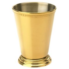 a gold colored metal cup on a white background