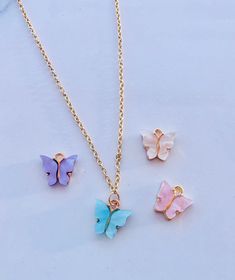 handmade 16in butterfly charm necklace with a gold chain available in four colors-pink, white, blue, and purple with a lobster claw closure Cute Butterfly Charm Necklace For Gift, Butterfly Charm Pendant Necklace For Jewelry Making, Cute Pink Necklaces With Butterfly Charm, Pinterest Jewelry, Tiny Necklace, Preppy Jewelry, Pretty Jewelry Necklaces, Bff Necklaces, Friendship Jewelry