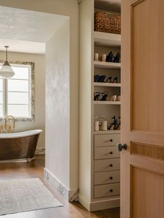 neutral and marble primary closet and bathroom