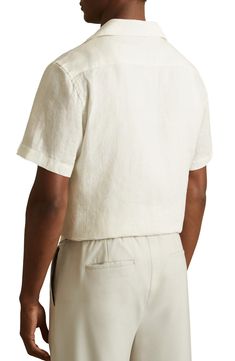 Tonal embroidery adds a refined finish to this camp shirt crafted from cool, breathable linen for a feel that's as comfortable as it is refined. 28" length; 44" chest (size Medium) Front button closure Notched collar Short sleeves 100% linen Dry clean or machine wash, line dry Made in Turkey White Linen Camp Shirt For Spring, Linen Camp Shirt With Johnny Collar For Spring, White Linen Johnny Collar Shirt, White Fitted Camp Shirt With Camp Collar, White Relaxed Linen Short Sleeve Shirt, White Relaxed Fit Linen Short Sleeve Shirt, White Linen Collared Short Sleeve Shirt, Classic Linen Shirt With Johnny Collar, Classic White Linen Camp Shirt