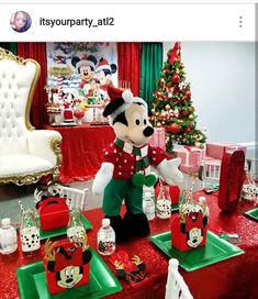 a mickey mouse christmas party with red and green decorations