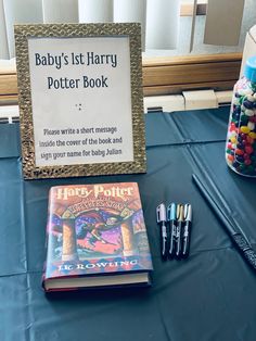 a harry potter themed baby's 1st harry potter book and crayons on a table