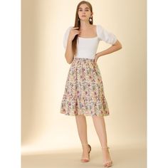 Made of floral-printed fabric, this midi skirt is high-waisted featuring an A-line silhouette. This flowy midi skirt with a tiered design and vintage allover floral prints. Featuring an A-line and tiered details, it is a summer casual skirt to be paired well with a top and sandals for a cute day look and with a stylish T-shirt and vintage high heels for a charming inspired look. Feminine Flared Skirt For Garden Party, Flowy Floral Print Maxi Skirt, Floral Print Midi Length Skirt, Feminine Flared Skirt With Floral Print, Floral Print Relaxed Midi Skirt, Relaxed Floral Print Midi Skirt, Midi Pleated Skirt For Brunch, Floral Print Relaxed Fit Midi Skirt, Multicolor Floral Print Midi Skirt